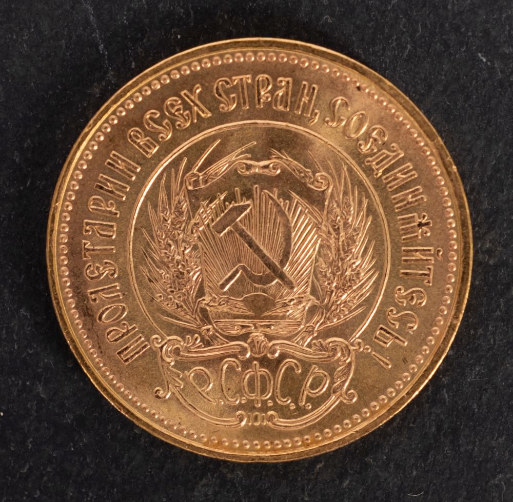 A Russian Chervonets gold coin.
