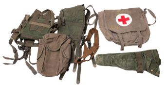 A collection of various webbing and bags, including two US PRC Radio carry harnesses.