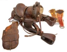 A New Mexico brown leather roping saddle, of traditional form with embossed floral decoration.