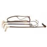 Three antler handled leather bound riding whips,