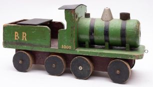 A scratch built wooden steam outline 2-4-2 locomotive in BR green No.