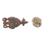 A late 18th/early 19th century iron and brass door knocker in the form of an urn,