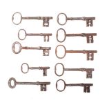 Ten various steel keys with plain bows and shaped shanks: (10)