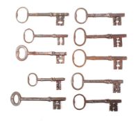 Ten various steel keys with plain bows and shaped shanks: (10)