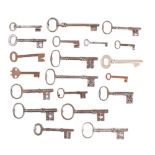 A collection of twenty various keys: including a 5 inch polished steel key and others (20)
