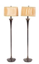 A pair of brushed metal standard lamps,