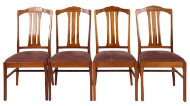 A teak and beechwood extending dining table and four chairs, probably by Parker Knoll,