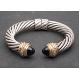 David Yurman, a hinged cuff bangle, of twisted cable design,