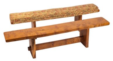 An oak refectory table and two matching benches,