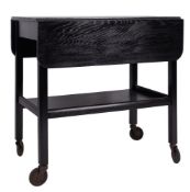 An ebonised ash low table, late 20th century; the rectangular top with a drawer to one long side,