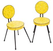 A pair of yellow vinyl covered side chairs, possibly by Willy van der Meeren,