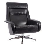 A black leather upholstered swivel armchair,