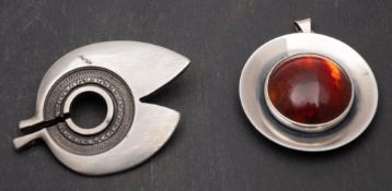 Two Modernist, Scandinavian items, including a circular amber pendant by Nils Erik From, Denmark,