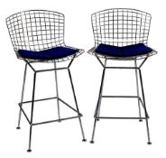 A pair of chromed metal counter stools, designed by Harry Bertoia (1915-1978) for Knoll,