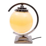 A chromed metal and opaque glass table lamp in Art Deco style,