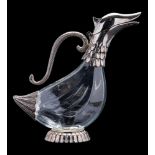 A clear glass and white metal mounted anthropomorphic decanter, in the form of a bird, 26cm high.