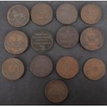 Thirteen 19th Century copper penny trade tokens, including Anglesey and Camarthen.