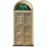 An Indian carved gold painted wood door casement with two doors,