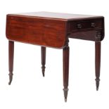 A Regency mahogany Pembroke table, early 19th century; the twin drop leaves with rounded corners,