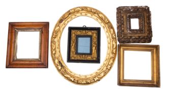A carved and giltwood oval picture or mirror frame,