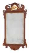 A George III mahogany and partly gilt fret carved mirror with pierced ho-ho bird cresting,