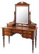 An Edwardian mahogany dressing table with rectangular swing mirror,