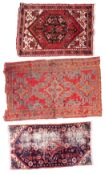 A Kurdish rug, the rose hexagonal stepped field with a central shaded geometric pole medallion,