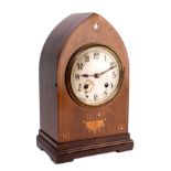 An Edwardian mantel clock the eight-day duration movement striking the hours and the quarters on