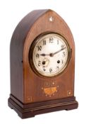 An Edwardian mantel clock the eight-day duration movement striking the hours and the quarters on