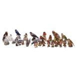 A collection of thirty-five English and Continental porcelain models of birds and a squirrel