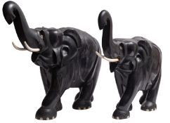 Two similar East African carved ebony and bone mounted models of elephants,