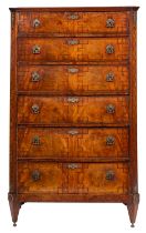 An early 19th-century French mahogany and inlaid upright chest of drawers;
