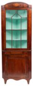 A George IV mahogany standing corner display cabinet in two sections,