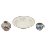 A small Chinese 'Hatcher Cargo' celadon dish and two small blue and white jarlets the dish incised