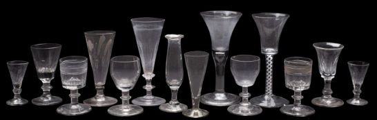 A mixed group of drinking glasses, comprising an opaque twist wine glass [chips to foot rim],