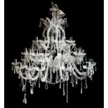 A contemporary cut glass three tier graduated twelve branch chandelier;