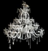 A contemporary cut glass three tier graduated twelve branch chandelier;