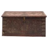 A 19th-century Zanzibar hardwood and brass studded trunk; with a hinged top enclosing a candle box,