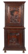 A late 19th-century French carved oak side cabinet; with a moulded foliate cornice,