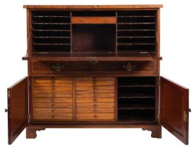 A 19th-century mahogany and inlaid typesetter's cabinet; bordered with sycamore lines,