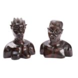 A pair of African carved ebony busts of a man and a woman,