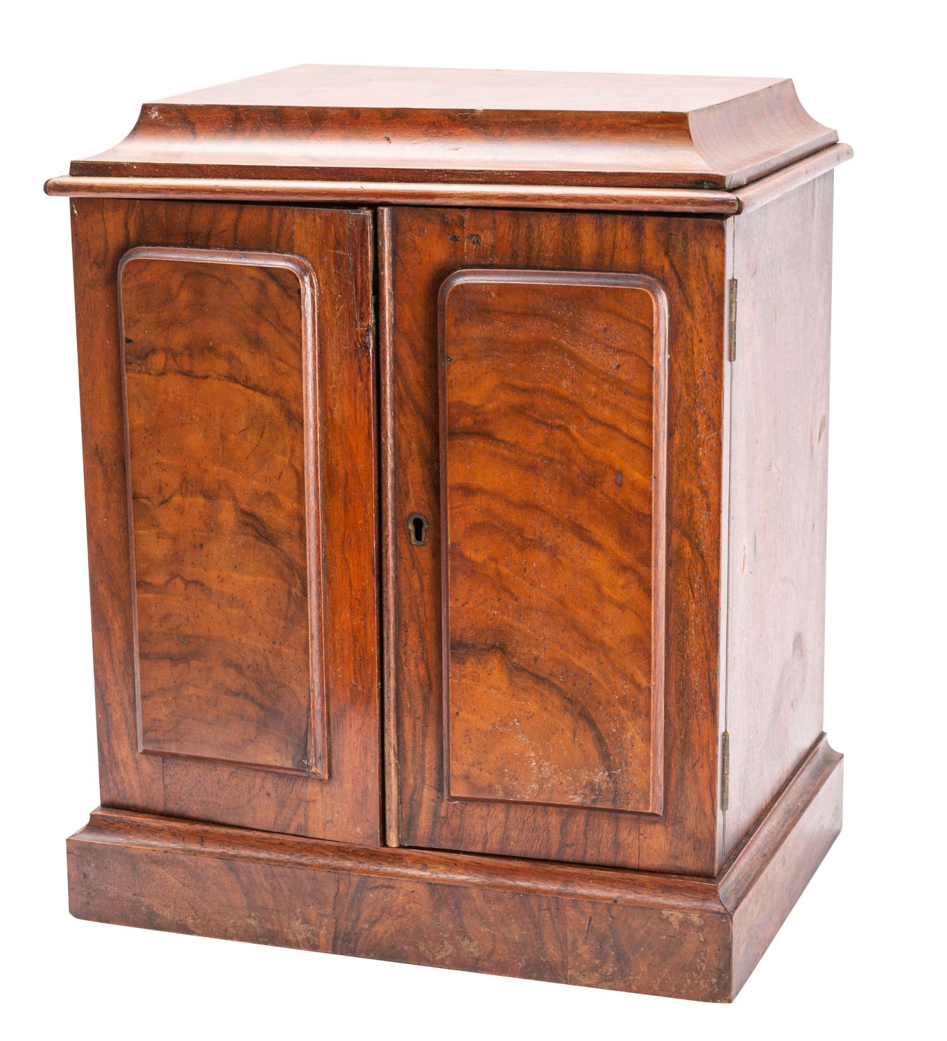 A Victorian walnut table top cigar cabinet, late 19th century; the top with cavetto moulded edges,