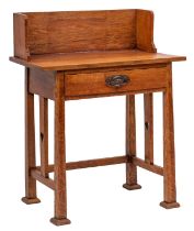 An Arts & Crafts oak writing table, 19th century; with a three quarter ledge superstructure,