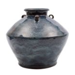 A Chinese stoneware jar of squat oviform with short raised neck and three small lug handles,