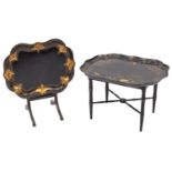A Victorian papier mache and black lacquer tray of shaped outline,