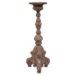A 19th-century Italianate carved limewood torchere; with a circular top,