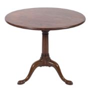 A 19th Century mahogany circular tea table in the George II taste,
