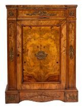 A Victorian walnut and gilt metal mounted pier cabinet; of slight recessed breakfront outline,