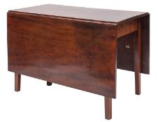 A George III mahogany rectangular drop flap dining table; the hinged top on square tapered legs;
