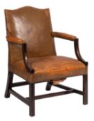 A mahogany and leather upholstered Gainsborough armchair in George III style,